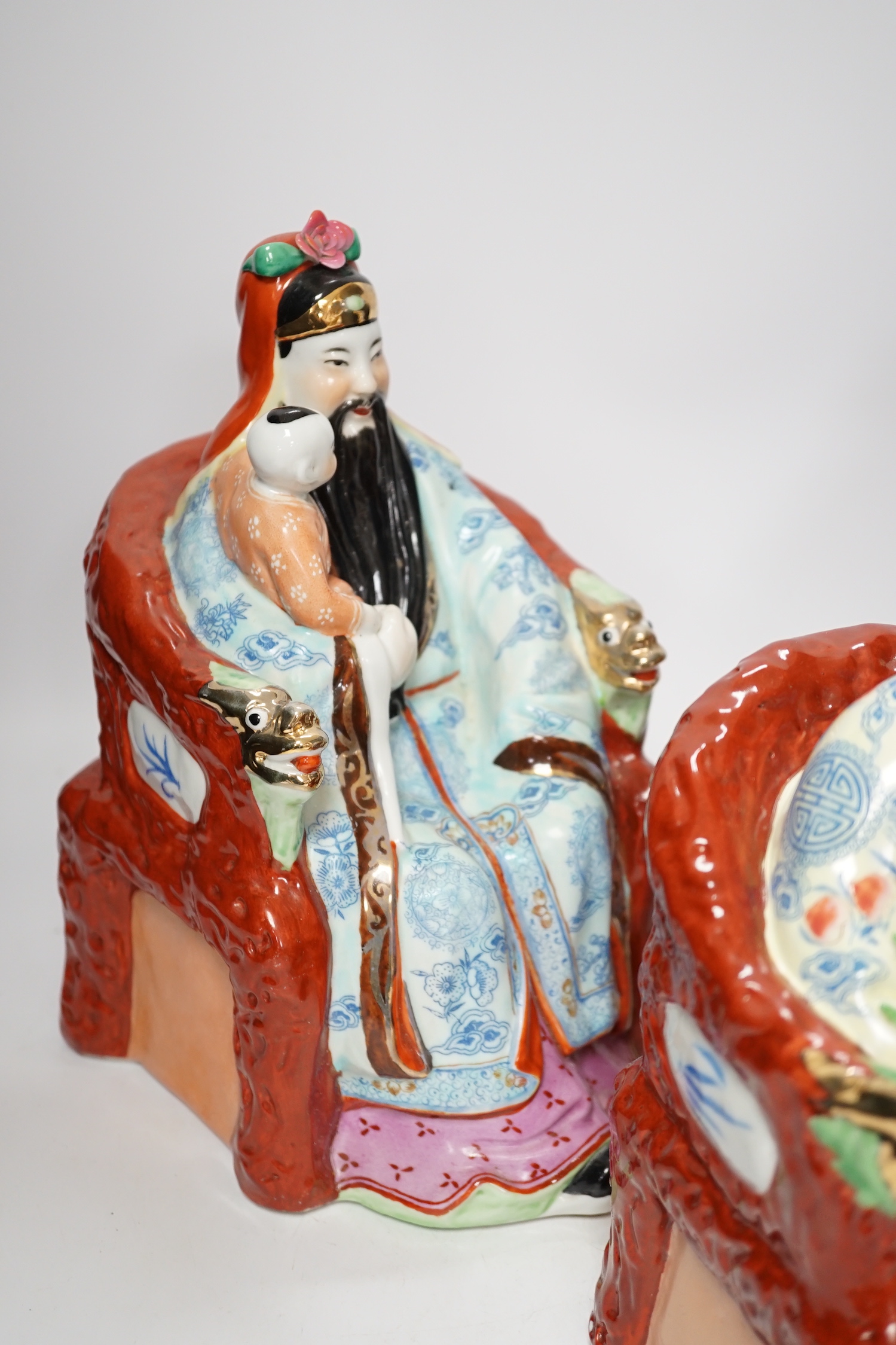 A set of three Chinese famille rose figures of the Three Star Gods (Sanxing), largest 25cm high
